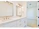 Double vanity bathroom with quartz countertops, gold fixtures, and mirrors at 2041 N Orchard --, Mesa, AZ 85213