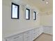 Spacious walk-in closet with ample built-in shelving and drawers at 2041 N Orchard --, Mesa, AZ 85213