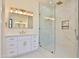 Elegant bathroom with marble shower, soaking tub, and white cabinetry at 2041 N Orchard --, Mesa, AZ 85213