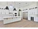 Modern kitchen with white cabinets, island, and stainless steel appliances at 2041 N Orchard --, Mesa, AZ 85213