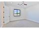 Spacious bedroom with ceiling fan and large window at 2041 N Orchard --, Mesa, AZ 85213