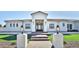 Stunning curb appeal, featuring a modern white exterior and landscaped lawn at 2041 N Orchard --, Mesa, AZ 85213