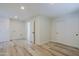 Bright laundry room with tile flooring and ample storage at 10952 W Tropicana Cir, Sun City, AZ 85351