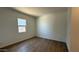 Bright bedroom with tile flooring and a window at 11465 E Utopia Ave, Mesa, AZ 85212