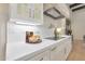 Modern kitchen with white cabinets, marble countertops and herringbone backsplash at 10801 E Happy Valley Rd # 27, Scottsdale, AZ 85255