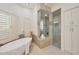 Stunning bathroom featuring a soaking tub, glass shower, and modern cabinetry at 10801 E Happy Valley Rd # 27, Scottsdale, AZ 85255