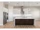 Modern kitchen with a large island and stainless steel appliances at 15424 E Dixileta Dr, Scottsdale, AZ 85262