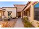 Inviting courtyard entry with a brick walkway, stone accents, and lush greenery at 3105 E Fruitvale Ct, Gilbert, AZ 85297
