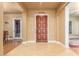 Elegant entryway with hardwood floors and a rich wood front door at 3105 E Fruitvale Ct, Gilbert, AZ 85297