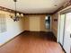 Spacious dining area with wood flooring and access to the patio at 10202 W Edgewood Dr, Sun City, AZ 85351
