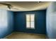 Spacious bedroom with ceiling fan and window shutters at 10202 W Edgewood Dr, Sun City, AZ 85351
