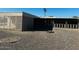 Large backyard with gravel and a screened patio area at 10202 W Edgewood Dr, Sun City, AZ 85351