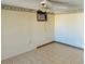 Living room with ceiling fan and tiled floors at 10202 W Edgewood Dr, Sun City, AZ 85351
