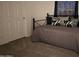Small bedroom with a daybed and ample closet space at 9302 E Broadway. -- # 147, Mesa, AZ 85208