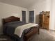 Cozy bedroom with a queen-size bed and antique dresser at 9302 E Broadway. -- # 147, Mesa, AZ 85208