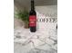 Kitchen counter with wine bottle, coffee sign, and marble countertop at 9302 E Broadway. -- # 147, Mesa, AZ 85208