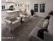 Spacious living room featuring comfortable seating and a view into the kitchen at 9302 E Broadway. -- # 147, Mesa, AZ 85208