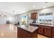 Open concept kitchen with island and views into living room at 3813 E Sierrita Rd, San Tan Valley, AZ 85143