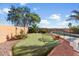 Backyard oasis with a putting green, sparkling pool, and patio area at 3813 E Sierrita Rd, San Tan Valley, AZ 85143