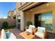 Private patio with seating area and lush landscaping at 756 E Zion Dr # 103, Gilbert, AZ 85297