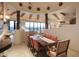 Bright dining room with large windows and wooden table at 9215 E Red Lawrence Dr, Scottsdale, AZ 85262