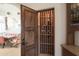Well-stocked wine cellar with custom wooden racking at 9215 E Red Lawrence Dr, Scottsdale, AZ 85262