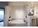 Spa-like bathroom with soaking tub and neutral color palette at 9215 E Red Lawrence Dr, Scottsdale, AZ 85262