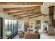 Living area with wood beams and mountain views at 9215 E Red Lawrence Dr, Scottsdale, AZ 85262