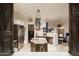 Open kitchen with island, stainless steel appliances, and views at 9215 E Red Lawrence Dr, Scottsdale, AZ 85262
