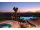 Expansive pool and spa at sunset with city views at 9215 E Red Lawrence Dr, Scottsdale, AZ 85262