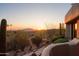Landscaped yard with desert plants and sunset views at 9215 E Red Lawrence Dr, Scottsdale, AZ 85262