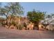 Landscaped front yard with a gated entry and desert plants at 9215 E Red Lawrence Dr, Scottsdale, AZ 85262
