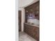 Butlers pantry with ample storage and granite countertop at 9215 E Red Lawrence Dr, Scottsdale, AZ 85262