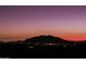 Breathtaking sunset view of the surrounding mountains and city lights at 9215 E Red Lawrence Dr, Scottsdale, AZ 85262