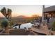 Luxury infinity pool with expansive desert and sunset views at 9215 E Red Lawrence Dr, Scottsdale, AZ 85262