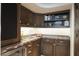 Convenient wet bar with cabinetry, sink, and wine cooler at 9215 E Red Lawrence Dr, Scottsdale, AZ 85262