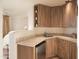 Small kitchenette with wood cabinets and tile countertops at 9215 E Red Lawrence Dr, Scottsdale, AZ 85262