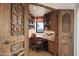 Spacious home office features built-in bookshelves and scenic views at 9215 E Red Lawrence Dr, Scottsdale, AZ 85262
