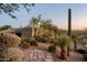 Stone pathway leads to the home's entrance with desert landscaping at 9215 E Red Lawrence Dr, Scottsdale, AZ 85262