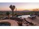 Luxury pool and spa with mountain views and desert landscaping at 9215 E Red Lawrence Dr, Scottsdale, AZ 85262