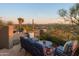 Enjoy breathtaking sunset views from this relaxing patio, complete with comfortable seating at 9215 E Red Lawrence Dr, Scottsdale, AZ 85262