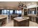 Gourmet kitchen with island, copper pot rack and views at 9215 E Red Lawrence Dr, Scottsdale, AZ 85262