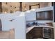 Convenient wet bar with a sink and mini-refrigerator at 9215 E Red Lawrence Dr, Scottsdale, AZ 85262