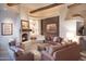 Living room with a cozy fireplace and natural light at 9215 E Red Lawrence Dr, Scottsdale, AZ 85262