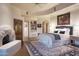 Serene main bedroom boasts a fireplace and large windows at 9215 E Red Lawrence Dr, Scottsdale, AZ 85262