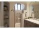 Spa-like bathroom with a large walk-in shower and built-in shelves at 9215 E Red Lawrence Dr, Scottsdale, AZ 85262