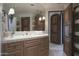 Bathroom with a large mirror and double vanity at 9215 E Red Lawrence Dr, Scottsdale, AZ 85262