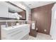 Bathroom with double vanity and wood-look tile at 8325 E Crestwood Way, Scottsdale, AZ 85250