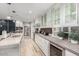 Modern kitchen with white cabinets, granite countertops, and a wine cooler at 8325 E Crestwood Way, Scottsdale, AZ 85250