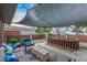 Relaxing backyard patio with fire pit and seating during the day at 8325 E Crestwood Way, Scottsdale, AZ 85250